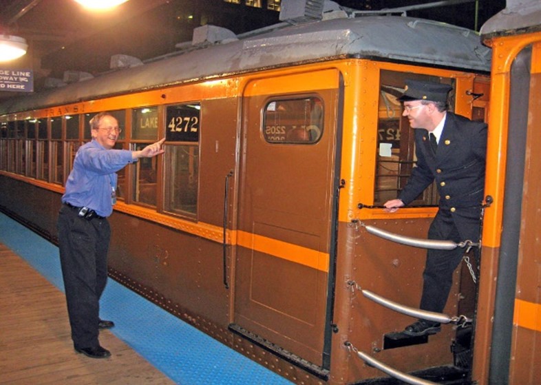 Intern Scott Greig filming a movie on a CTA train.
