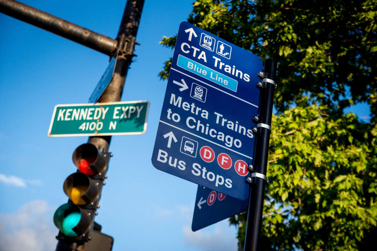 Wayfinding sign for CTA trains, Metra trains and CTA buses.