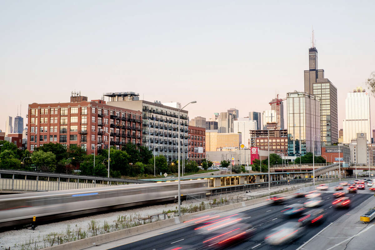 Scenic view of expressway and Chicago buildings.