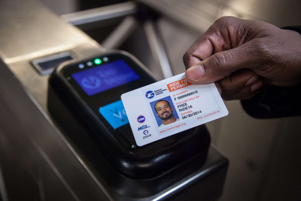 A person's Ride Free Permit card being used to pay for fare at Ventra turnstile.